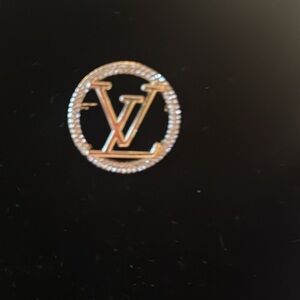 LV Brooch signed